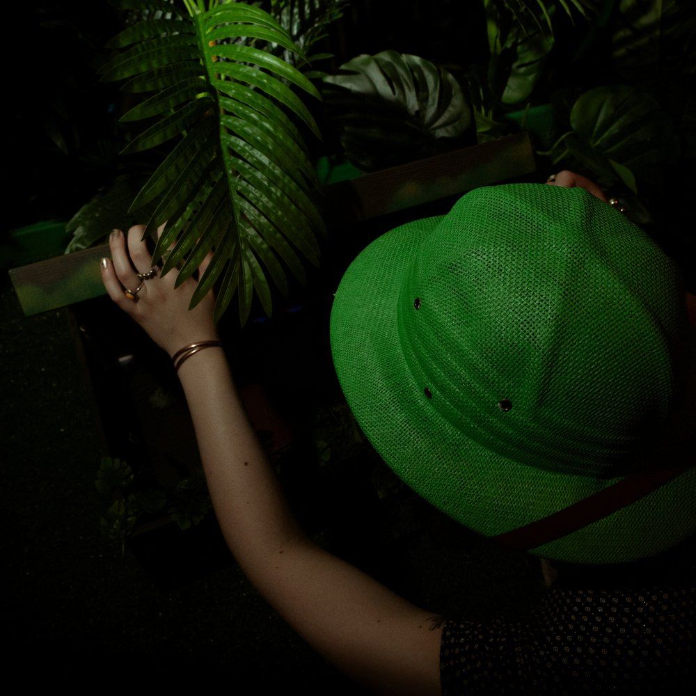 A player in an explorer’s helmet solving puzzles in the Call of the Jungle room, escape room Warsaw Praga