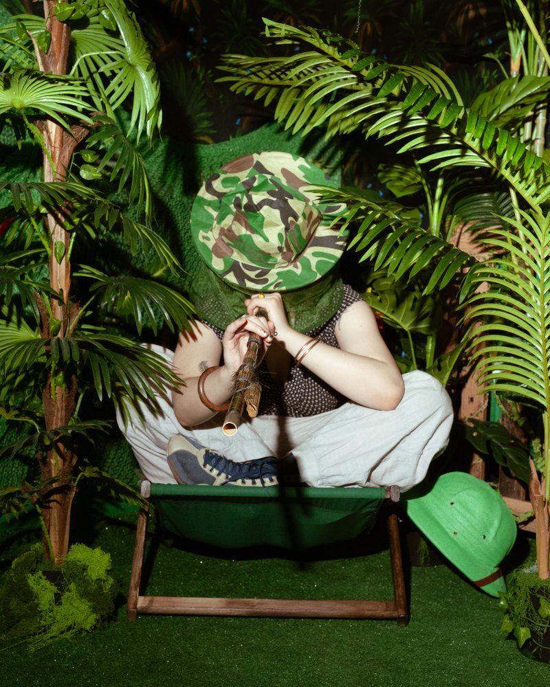 Player amid lush jungle foliage – the Call of the Jungle room at Keyword escape room in Warsaw